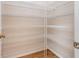 Spacious pantry features laminate floors and white wire shelving for plenty of storage at 10257 Dovehill Ln, Clermont, FL 34711