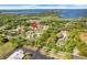 An aerial shot displays the community's convenient location near a lake and surrounding green spaces at 1051 S Highland St # 4B, Mount Dora, FL 32757