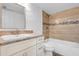 Bathroom with shower/tub combo, vanity and neutral tile at 1051 S Highland St # 4B, Mount Dora, FL 32757