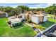 A charming condo community featuring lush lawns and mature trees, as well as a dedicated parking area at 1051 S Highland St # 4B, Mount Dora, FL 32757