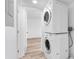 Laundry room with stacked washer and dryer at 1051 S Highland St # 4B, Mount Dora, FL 32757