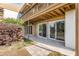 Back patio features glass doors and concrete flooring, perfect for outdoor relaxation and entertaining at 1051 S Highland St # 4B, Mount Dora, FL 32757