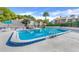 Community swimming pool surrounded by lounge chairs, perfect for relaxing and enjoying the Florida sunshine at 1051 S Highland St # 4B, Mount Dora, FL 32757