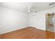 Bedroom featuring laminate wood flooring, a ceiling fan, and closet at 1089 Nash Loop, The Villages, FL 32162