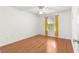 Bedroom with hard wood floors, a ceiling fan, and a window at 1089 Nash Loop, The Villages, FL 32162