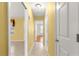 Hallway features tile flooring and access to other rooms at 1089 Nash Loop, The Villages, FL 32162