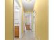 Hallway offering access to bathroom, bedroom, and other rooms at 1089 Nash Loop, The Villages, FL 32162