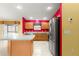 Bright kitchen featuring stainless steel appliances, ample counter space, and light wood cabinets at 1089 Nash Loop, The Villages, FL 32162