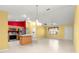 Open-concept kitchen and dining area features tile floors and lots of natural light at 1089 Nash Loop, The Villages, FL 32162