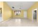 Bright living room featuring a window, ceiling fan, and tile flooring at 1089 Nash Loop, The Villages, FL 32162