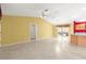 Spacious living room featuring tile floors, bright walls and a fan for comfortable living at 1089 Nash Loop, The Villages, FL 32162