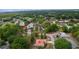 Aerial view showing property location in relation to community pool and amenities with mature tree coverage around neighborhood at 11497 Sw 82Nd Court Rd, Ocala, FL 34481
