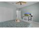 Bedroom with a TV, closet, ceiling fan, and view of the spacious bed at 11497 Sw 82Nd Court Rd, Ocala, FL 34481