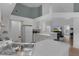 Modern kitchen with a breakfast bar, ample cabinet space, and an open layout that flows into the living area at 11497 Sw 82Nd Court Rd, Ocala, FL 34481
