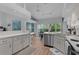 Airy kitchen with vaulted ceilings, a breakfast nook, stainless steel appliances, and abundant natural light at 11497 Sw 82Nd Court Rd, Ocala, FL 34481