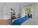 Bright main bedroom offering sliding glass doors to the lanai and stylish decor at 11497 Sw 82Nd Court Rd, Ocala, FL 34481