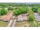 Aerial view of the property showing lake views and the private backyard pool at 11763 Oswalt Rd, Clermont, FL 34711