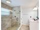 Bathroom with a glass-enclosed shower and a vanity with a light-colored countertop at 11763 Oswalt Rd, Clermont, FL 34711