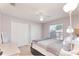 Inviting bedroom with a neutral color palette, ample closet space, and natural light at 11763 Oswalt Rd, Clermont, FL 34711