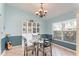 Charming dining room featuring a glass table, accent lighting, and custom shelving at 11763 Oswalt Rd, Clermont, FL 34711