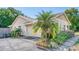 Single story home with a two-car garage and meticulously maintained landscaping at 11763 Oswalt Rd, Clermont, FL 34711