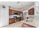 Stylish kitchen equipped with stainless appliances, granite counters, and ample cabinet space at 11763 Oswalt Rd, Clermont, FL 34711