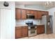 Well-equipped kitchen with stainless appliances, granite counters, and modern finishes at 11763 Oswalt Rd, Clermont, FL 34711