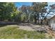 Large fenced backyard with mature trees, offering a private outdoor space at 11987 Se 95Th Ter, Belleview, FL 34420