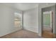 Comfortable bedroom featuring natural light, carpet, and neutral decor with a closet at 11987 Se 95Th Ter, Belleview, FL 34420
