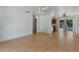 Open-concept space featuring light hardwood floors, neutral walls, and natural light at 11987 Se 95Th Ter, Belleview, FL 34420