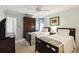 Cozy bedroom with two beds, a ceiling fan, and ample closet space at 1202 Bly Ct, Eustis, FL 32726