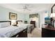 Comfortable bedroom with two beds, a ceiling fan, and plenty of natural light at 1202 Bly Ct, Eustis, FL 32726
