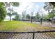 Fenced lot for boat storage with grassy areas and view of the lake at 1202 Bly Ct, Eustis, FL 32726