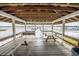 Covered dock featuring wooden benches and picnic table offering serene lake views for relaxing and entertaining at 1202 Bly Ct, Eustis, FL 32726