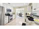 Well-equipped kitchen with white cabinets, stainless appliances, and granite countertops at 1202 Bly Ct, Eustis, FL 32726