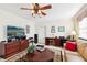 Inviting living room with a fan, lots of seating, and access to workspace at 1202 Bly Ct, Eustis, FL 32726