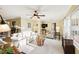 Bright living room with neutral carpet, comfortable seating and a large window at 1202 Bly Ct, Eustis, FL 32726