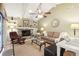 Cozy living room with a stone fireplace, built-in shelves, and comfortable seating arrangement at 1202 Bly Ct, Eustis, FL 32726