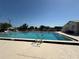 Inviting community pool with clear blue water and ample deck space for lounging and sunbathing at 121 Maple Dr, Debary, FL 32713