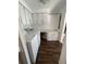 Functional laundry room with white cabinets, countertop space, and a modern washer and dryer set at 121 Maple Dr, Debary, FL 32713