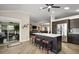 Kitchen with seating at island, stainless appliances, ample cabinet space, and an adjacent living area at 1210 Weaton Ct, The Villages, FL 32162