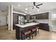 Charming kitchen featuring a central island with seating and stainless steel appliances at 1210 Weaton Ct, The Villages, FL 32162