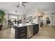 Island kitchen with stainless steel appliances, sleek countertops, and a breakfast nook at 1210 Weaton Ct, The Villages, FL 32162