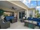 Cozy lanai with ceiling fan, comfortable seating and view to the pool at 1210 Weaton Ct, The Villages, FL 32162