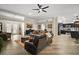 Large living room showcases stylish decor and seamlessly integrates with modern kitchen at 1210 Weaton Ct, The Villages, FL 32162