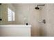 Modern tiled shower featuring a rainfall shower head and glass enclosure at 1210 Weaton Ct, The Villages, FL 32162