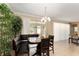 Cozy dining area with unique seating and natural light streaming through large windows at 12511 Se 91St Terrace Rd, Summerfield, FL 34491