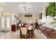 Elegant dining room with tiled floors, chair rail, and plenty of space at 12511 Se 91St Terrace Rd, Summerfield, FL 34491