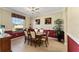 Formal dining room with elegant finishes, natural light and comfortable seating at 12511 Se 91St Terrace Rd, Summerfield, FL 34491