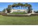Elegant entrance sign for Del Webb's Spruce Creek Country Club surrounded by lush greenery at 12511 Se 91St Terrace Rd, Summerfield, FL 34491